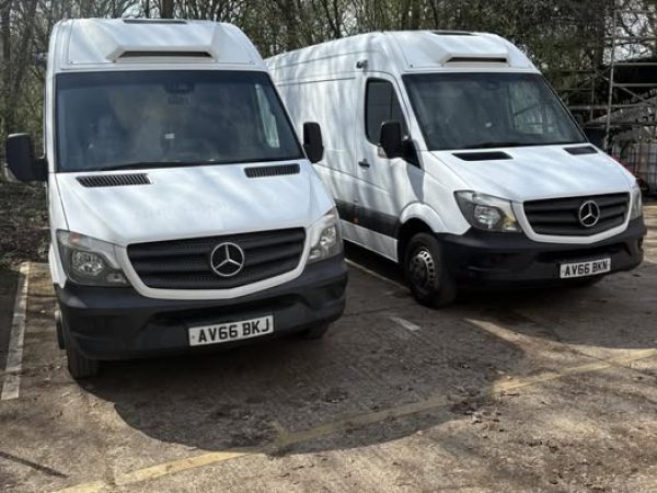 Mercedes-Benz Category C1 vehicles parked, showcasing the design and features relevant for practical driving training.